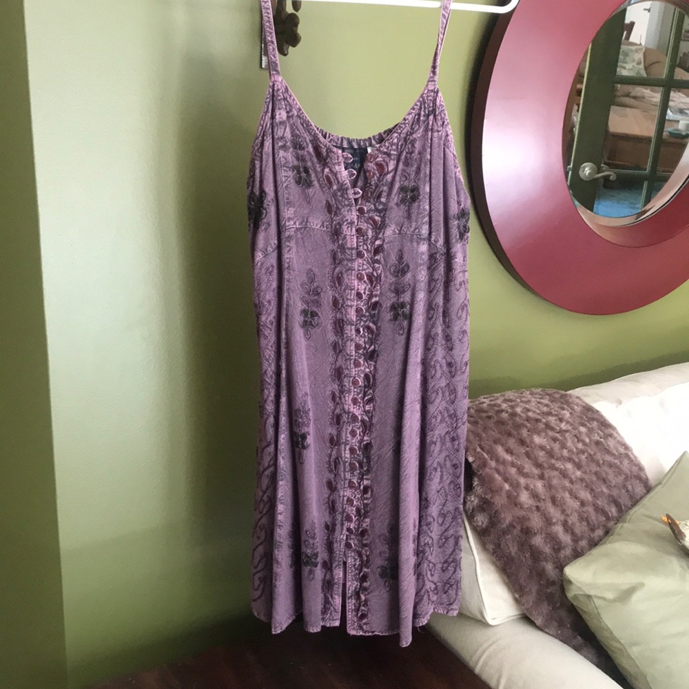 Purple dress with stitched flowers.